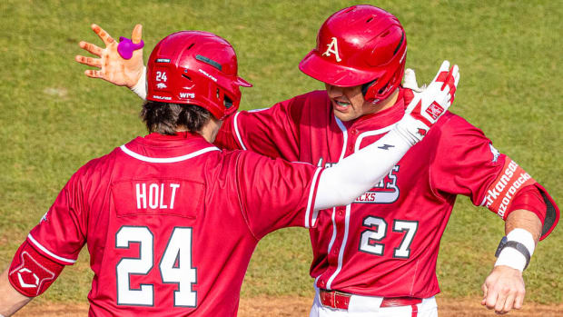 Razorbacks Ryder Helfrick celebrating with Peyton Holt